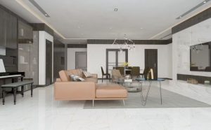 Modern open-concept living and dining area featuring marble flooring, leather sectional sofa, and contemporary lighting, a result of professional remodeling services.