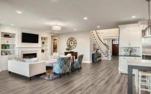 Spacious modern living room with open kitchen and stylish finishes, highlighting quality Residential Remodeling Services.