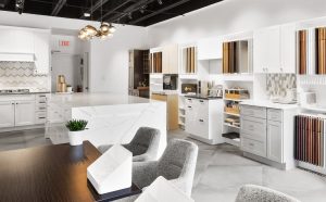 This image showcases a modern kitchen with sleek white cabinetry, stylish fixtures, and innovative design options, perfect for a kitchen remodeling company to highlight their services.