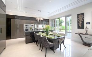This image showcases a luxurious kitchen with high-end finishes, modern appliances, and elegant dining spaces, highlighting the best luxury kitchen features.