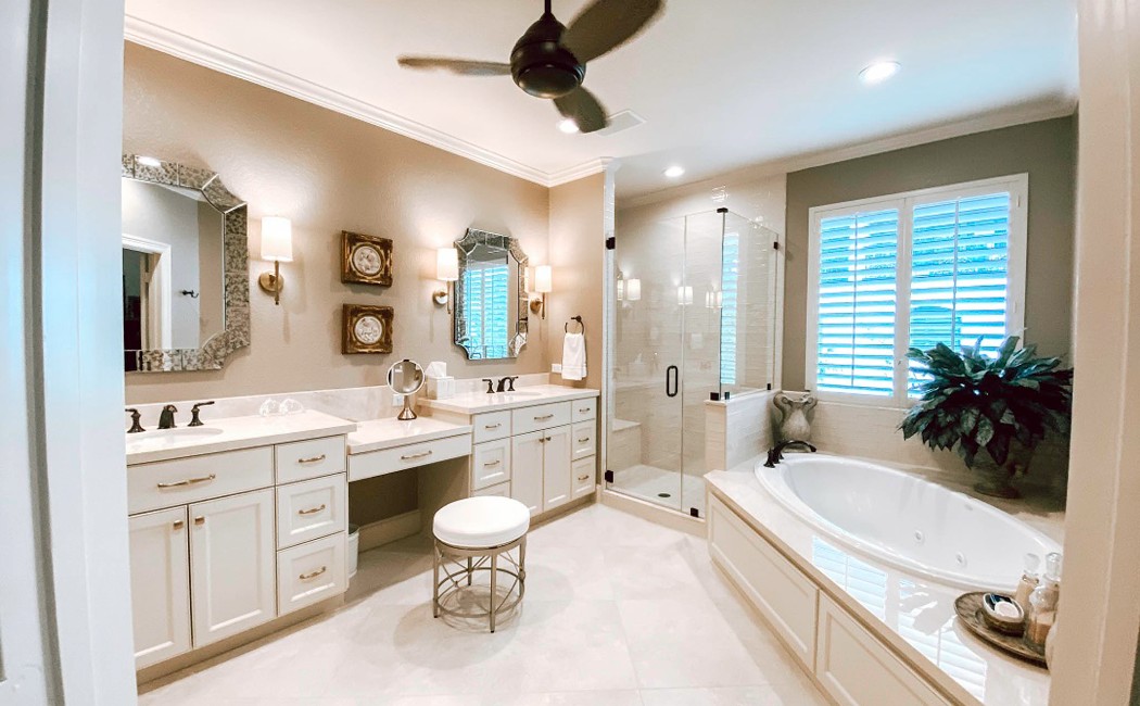 A spacious, modern bathroom with a large soaking tub, glass shower, and elegant cabinetry, reflecting the quality delivered by the Best Bathroom Remodelling Services.