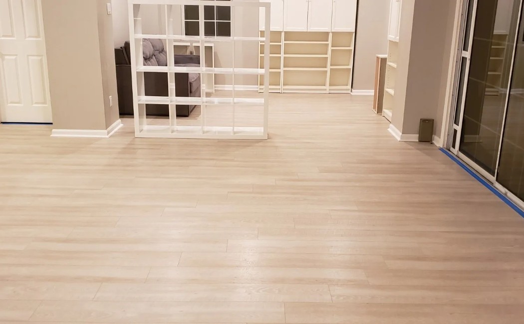 Spacious Modern Interior with Expert LVP Flooring Services Spacious interior featuring expert LVP flooring services with light wood-look vinyl planks that create a clean, modern, and durable foundation throughout the home.