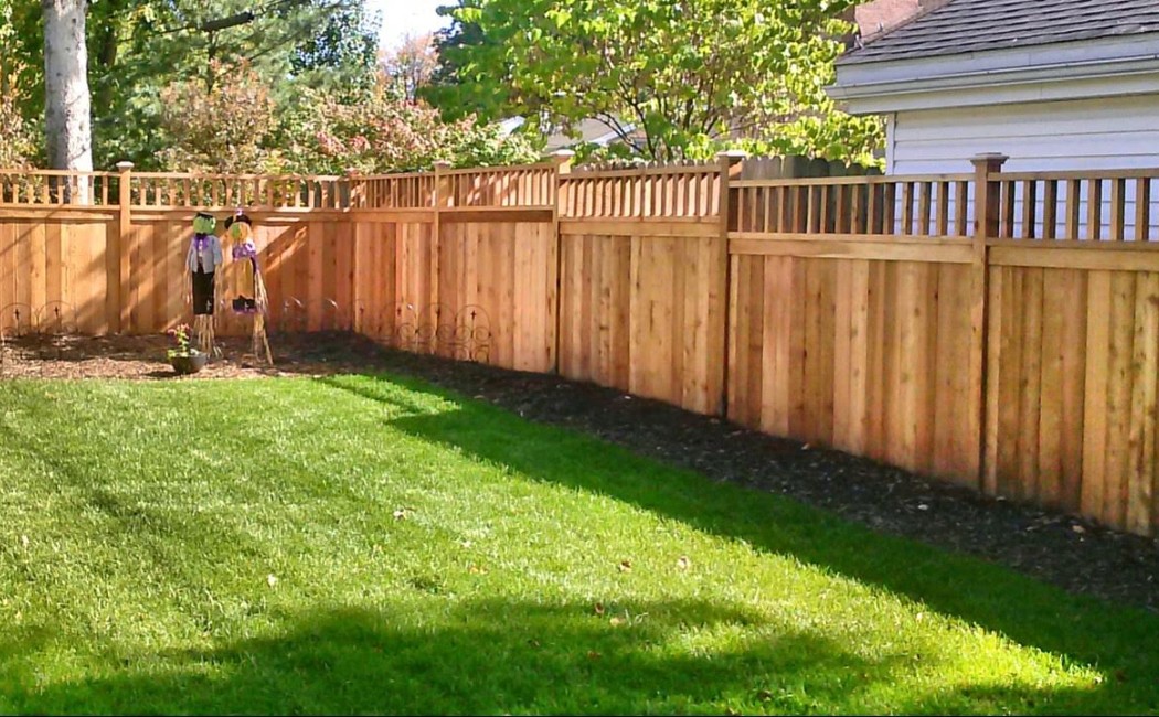 Professional Fence Repairing Company Enhancing Backyard Privacy and Appeal A well-maintained wooden backyard fence installed by a professional Fence Repairing Company, enhancing privacy, security, and curb appeal in a landscaped garden area