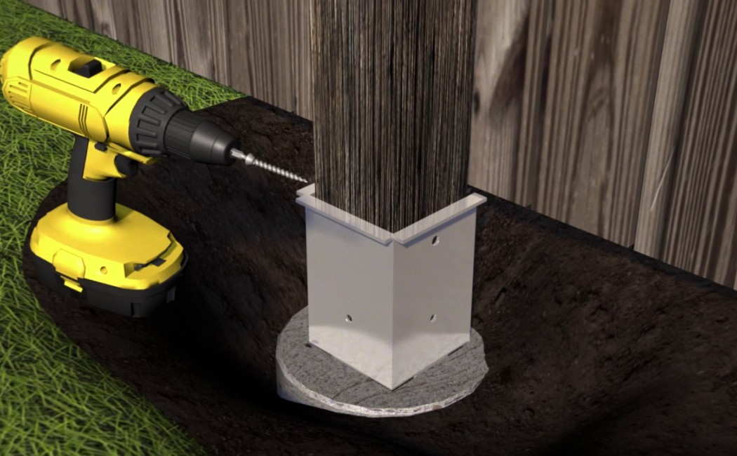 Professional Fence Repair for Strong and Secure Post Installation A close-up view of a power drill securing a wooden fence post into a metal bracket set in concrete, highlighting professional Fence Repair for strong and long-lasting support.